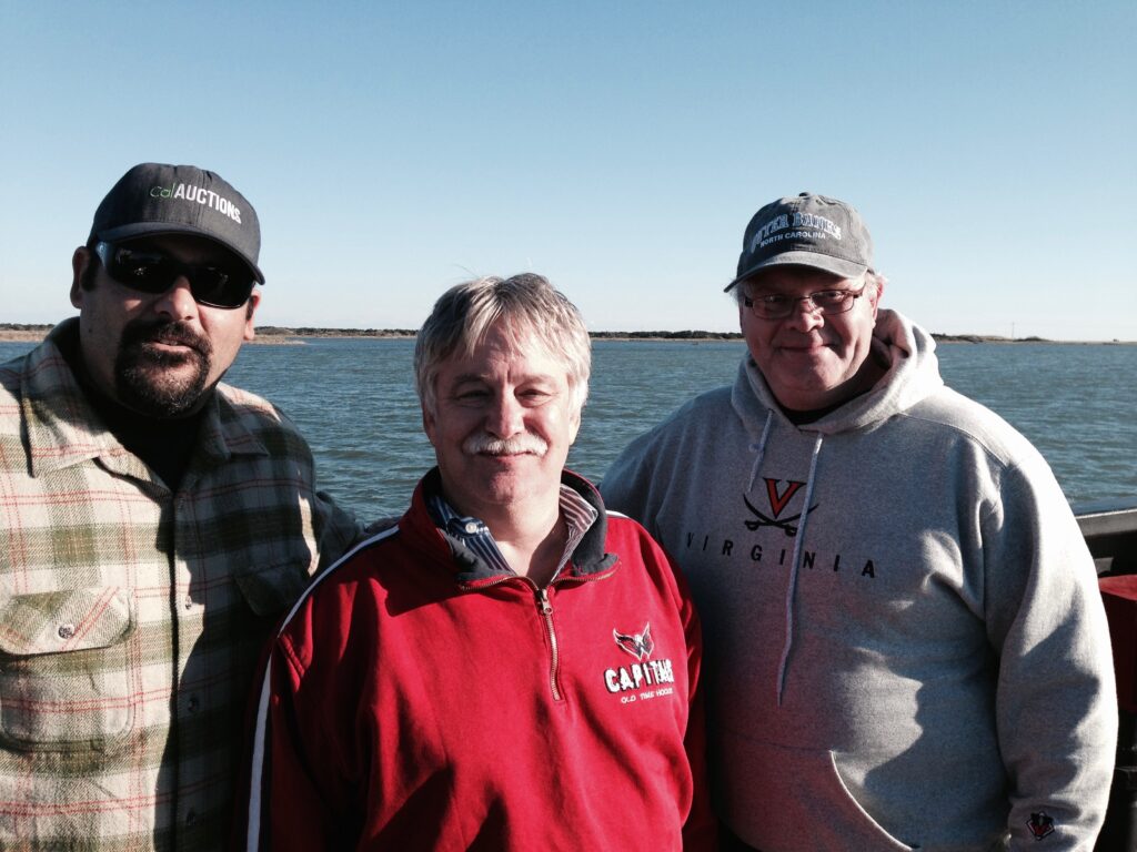 Jason Hanks, Chris Rasmus and Ron Leftwich, Auctioneers. 